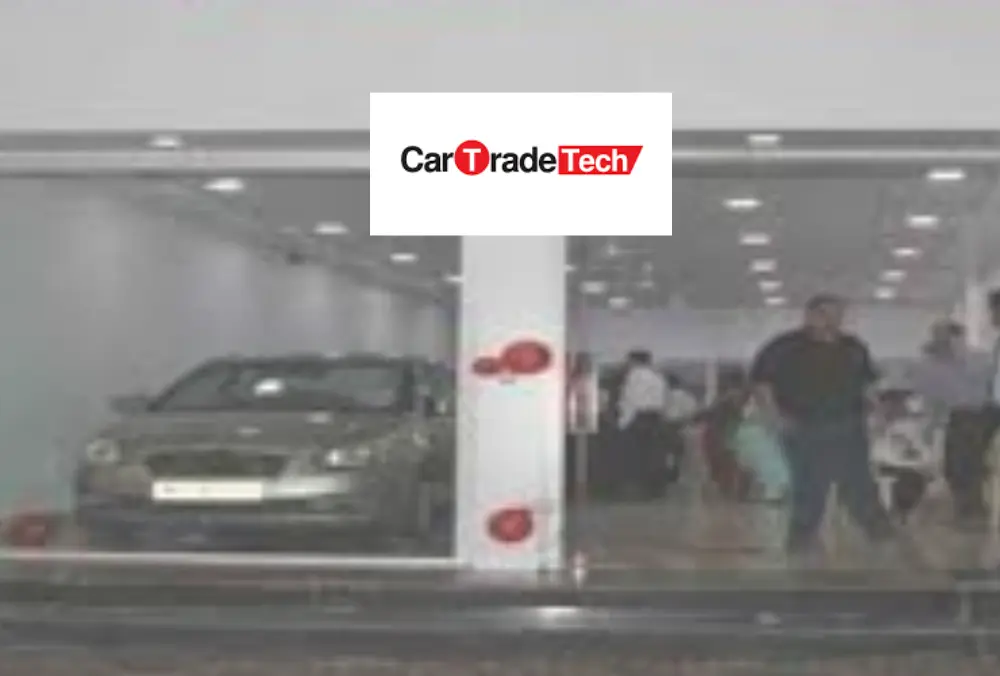 CarTrade Tech car showroom with customers and displayed vehicle