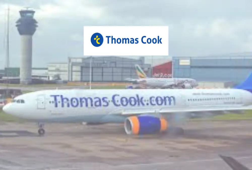 Thomas Cook logo over airplane on airport runway