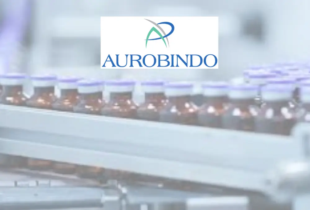 Aurobindo logo over pharmaceutical vial production line