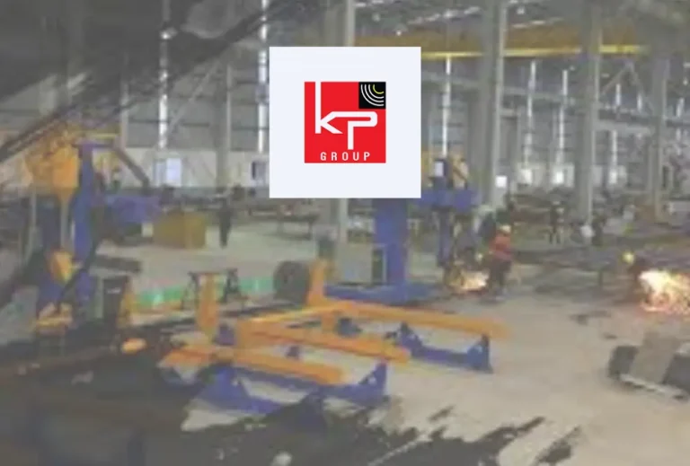 KP Group logo over factory floor with machinery and welding