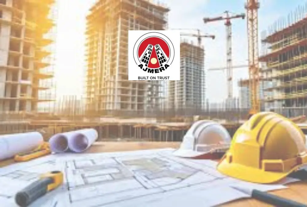 Ajmera real estate construction site with building plans