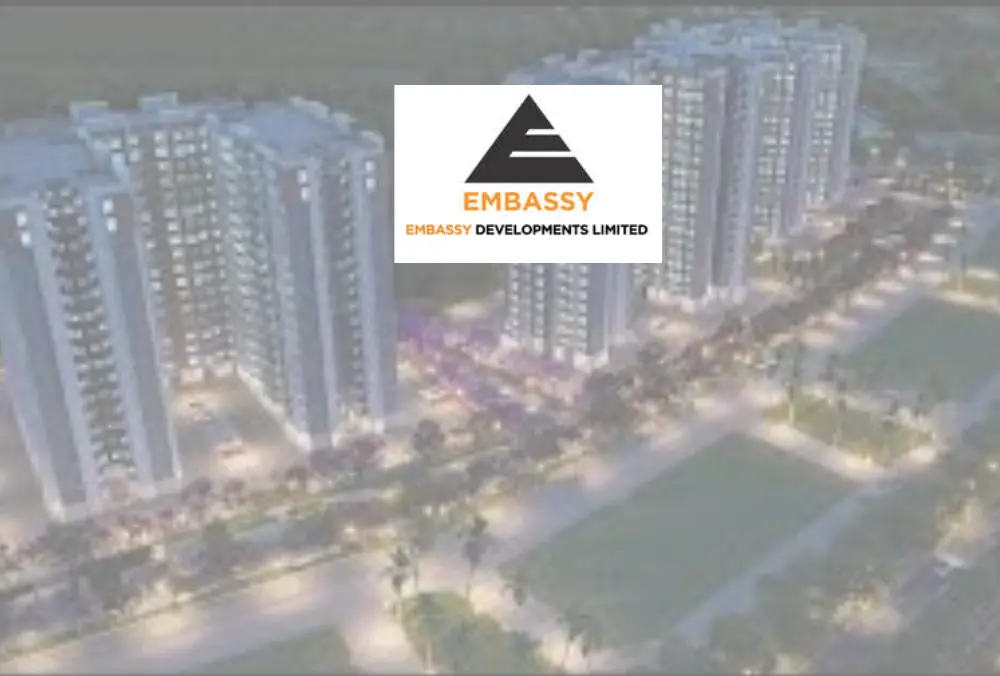 Embassy logo over aerial view of high-rise residential towers
