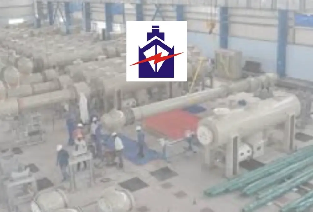 Electrical equipment manufacturer logo over industrial factory floor