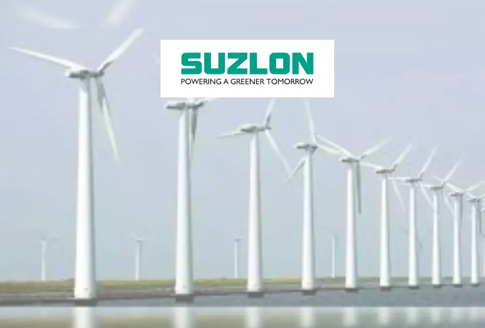 Suzlon logo displayed over wind turbines at renewable energy site